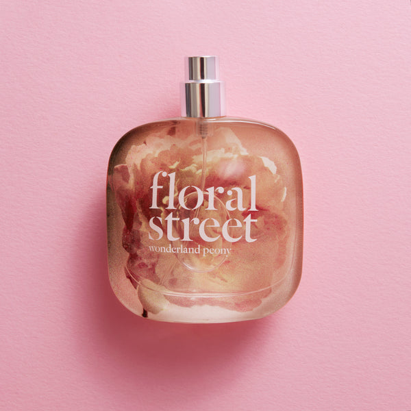 Floral Street Wonderland Peony perfume 50ml bottle on a pink background