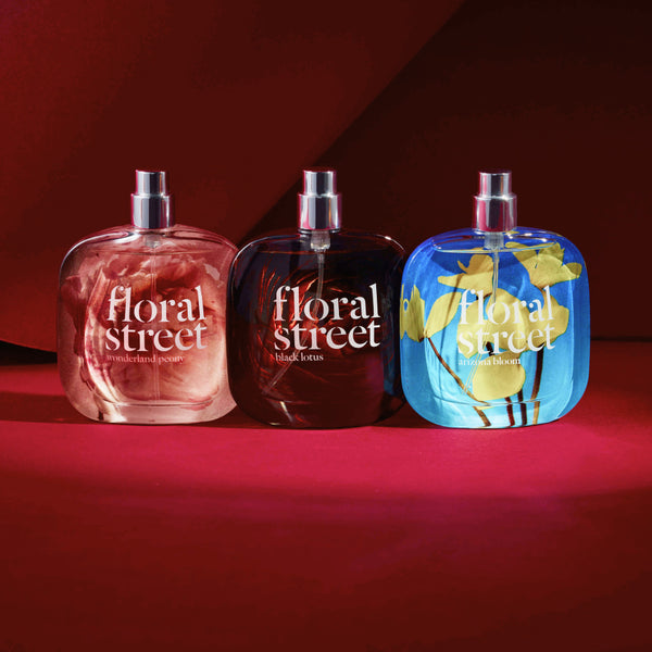 Collection of Floral Street bestselling perfume bottles on red background
